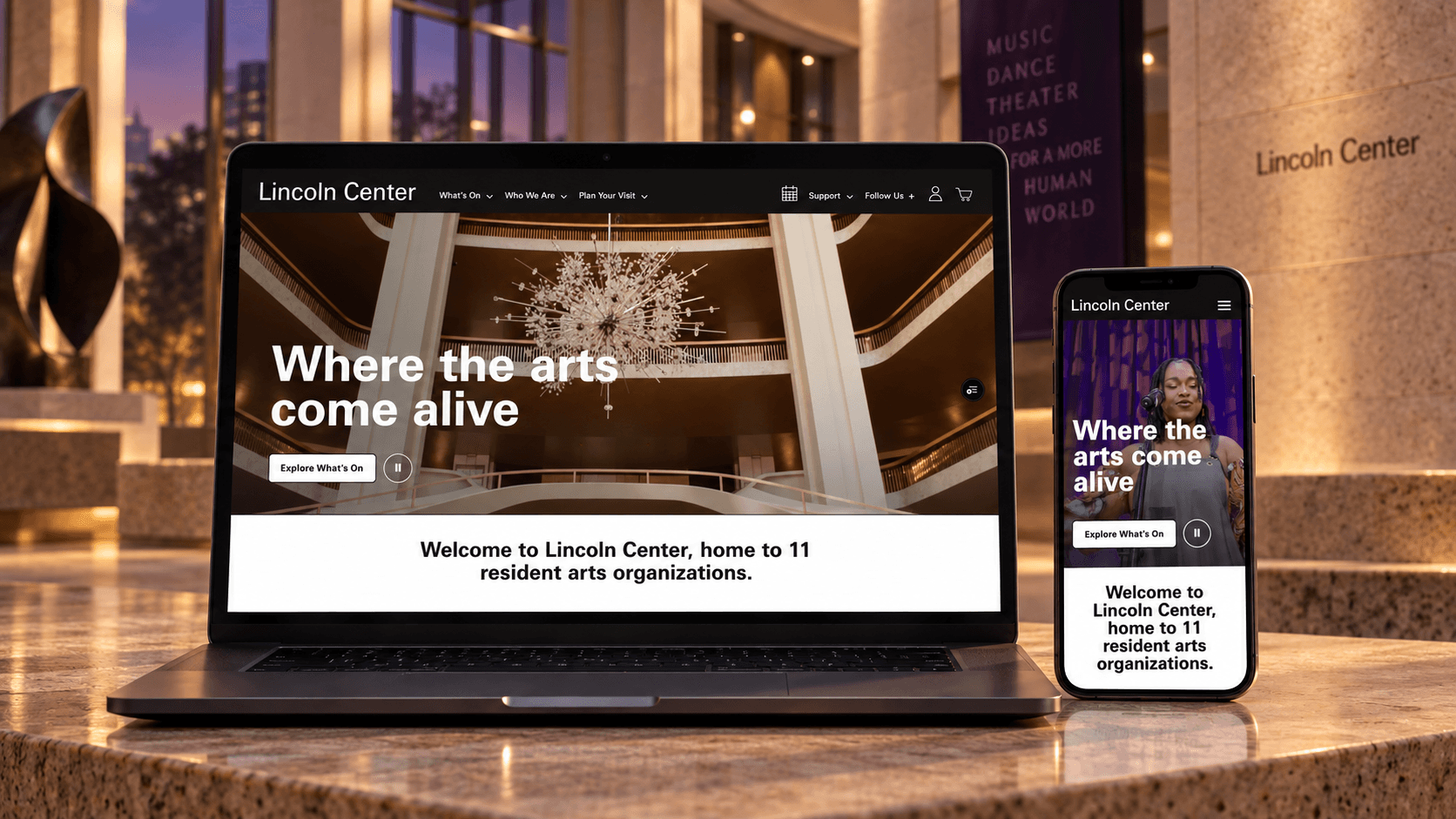 Lincoln Center homepage shown on a laptop and mobile phone in a warm performing-arts interior