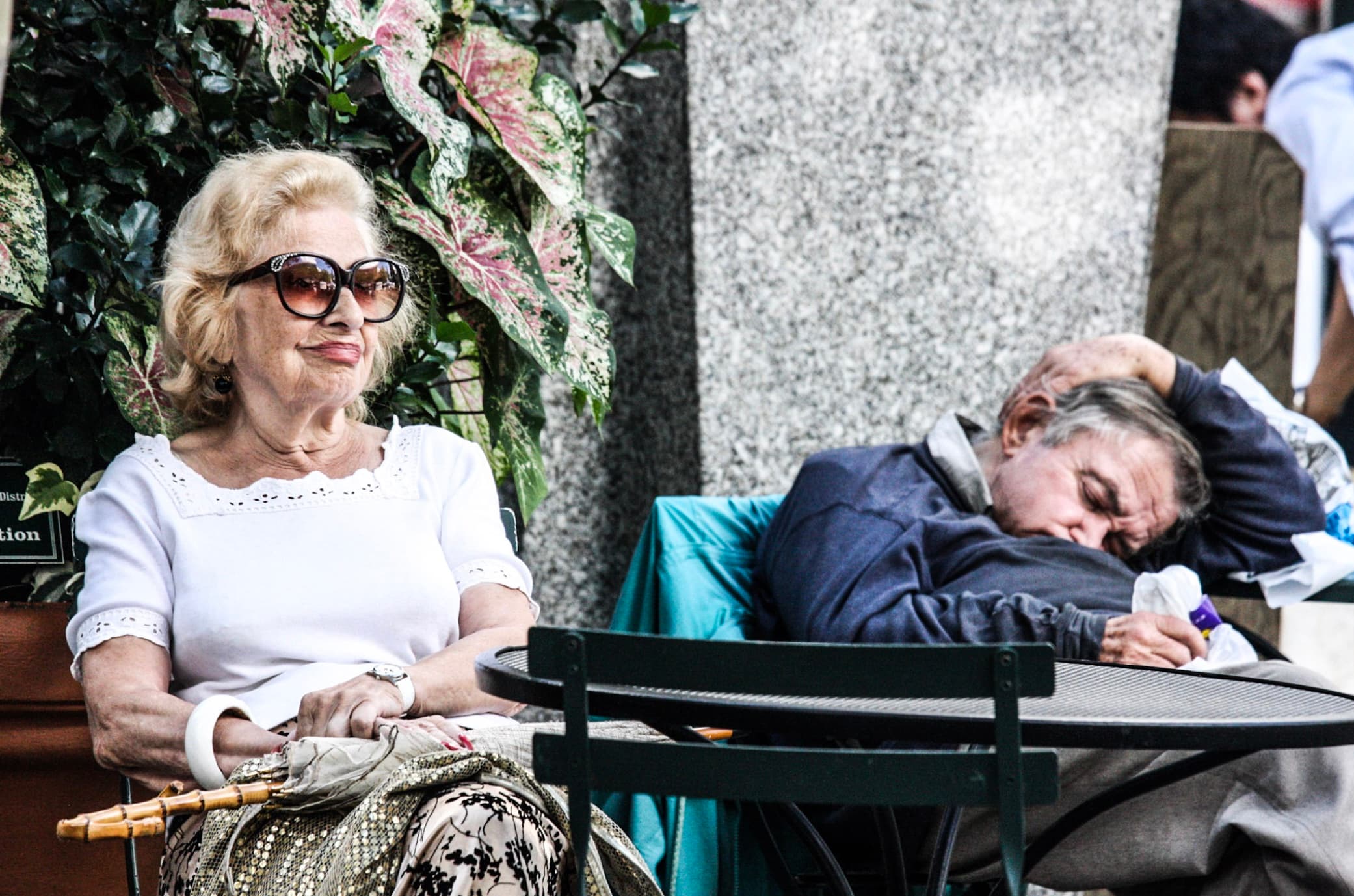 Two people sharing a quiet moment at an outdoor New York cafe